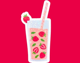 May include: A glass of pink strawberry lemonade with a straw and strawberries inside. The glass has a white border and is on a red background.