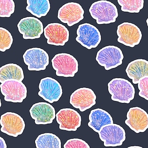 May include: A pattern of colorful seashell stickers on a dark blue background. The stickers are in various colors, including pink, blue, orange, green, and purple, with glitter accents.