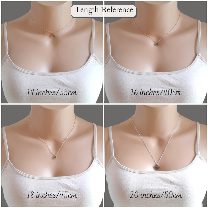 May include: A gold-toned chain necklace with a small pendant shown in four different lengths: 35 cm, 40 cm, 45 cm, and 50 cm. The necklace is displayed on a mannequin wearing a white tank top to demonstrate the varying drop lengths of the jewellery.