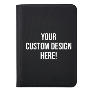 May include: A black zippered binder with the text "YOUR CUSTOM DESIGN HERE!" in white. The binder is rectangular and appears to be made of a leather-like material. The text suggests the product is customizable.