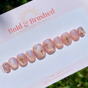 Cateye Gems and Gold Stars Celestial Press On Nail Set, Iridescent Pink and Blue Galaxy Hand Painted Extensions.