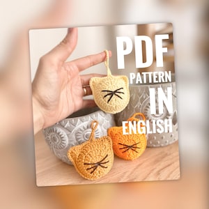 May include: Crochet cat amigurumi pattern in PDF format. The pattern is written in English. The image shows three crocheted cats in different colors: yellow, orange, and brown.