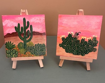 Colorful Desert Skies w/cactus. (Set of 2) 4X4” Canvas, easel’s included. Hand painted w/acrylic paint.