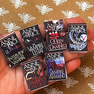 May include: A collection of six paperback books by Anne Rice, featuring titles like "Interview with the Vampire", "The Vampire Lestat", "The Queen of the Damned", "The Tale of the Body Thief", "Memnoch the Devil", and "The Vampire Armand".