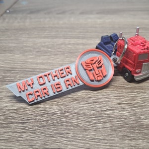 Porte-clés avec logo Transformers Autobot Cadeau unique pour les fans de Transformers image 1