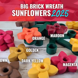 May include: A wreath made of brick-shaped pieces with sunflower-shaped holders in various colors, including orange, maroon, golden, dark yellow, brown, magenta. The wreath is labeled "BIG BRICK WREATH SUNFLOWERS 2025".