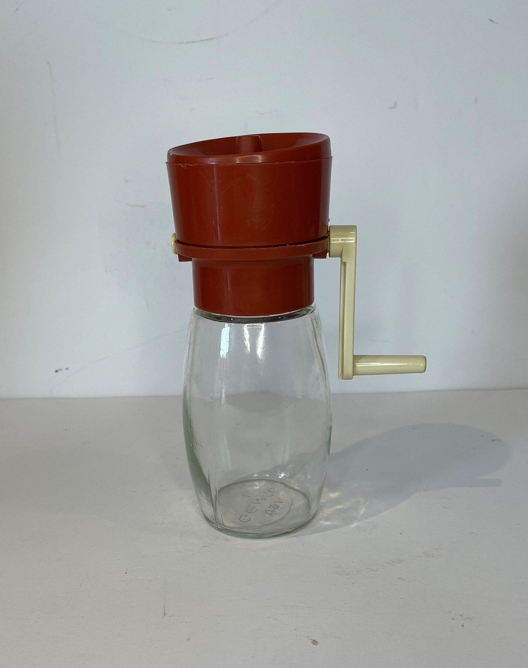 1930s vintage nut grinder, old red paint metal hand crank nut crusher w/  glass jar