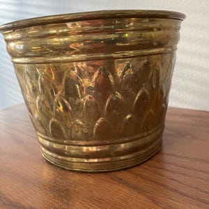 May include: A set of three ceramic mugs with a speckled, matte finish. The mugs are in shades of cream, light gray, and dark gray. Each mug has a simple, minimalist design and a rounded handle. Perfect for coffee or tea.