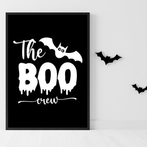 May include: Black and white printable sign with the text "The Boo Crew" and a bat with eyes. There are three black bats in the background.