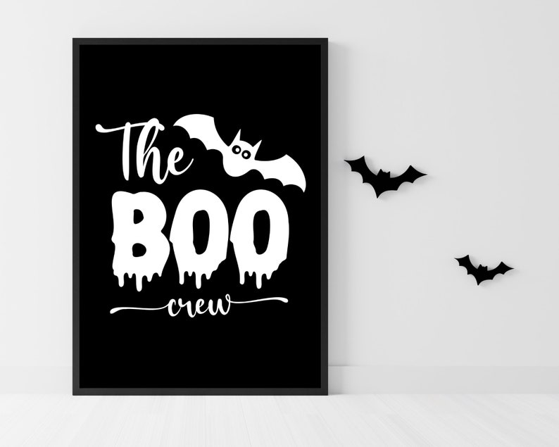 May include: Black and white printable sign with the text "The Boo Crew" and a bat with eyes. There are three black bats in the background.