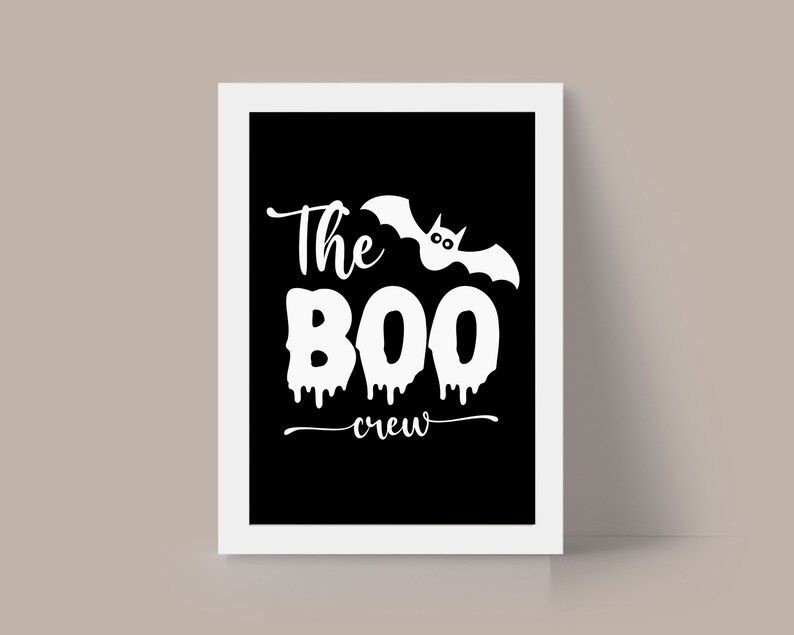 May include: A black and white printable sign with the text "The Boo Crew" and a white silhouette of a bat with dripping blood.