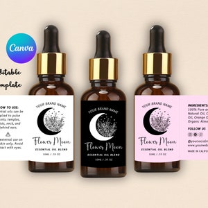 May include: Three amber glass bottles with gold lids and black labels. The labels feature a crescent moon with stars and floral designs. The text on the labels reads "Your Brand Name", "Flower Moon", "Essential Oil Blend", "10ml / .35 oz", "Ingredients: 100% Pure and Natural Oil, Coconut Oil, Orange Oil, Organic Almond Oil", "Follow Us", "@yoursocialmedia", "www.yourwebsite.com", "Made in California".