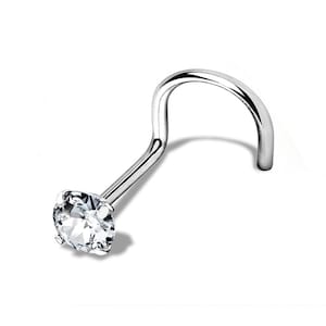 May include: A silver nose ring with a clear round gemstone.