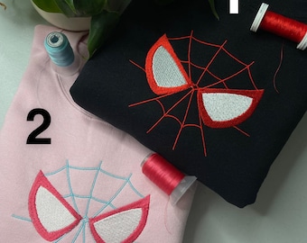 Bonita sudadera con capucha y camiseta a juego con bordado de araña. ENVÍO GRATIS.