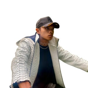May include: A white textured jacket with black trim and a black baseball cap. The jacket features a scale-like pattern. The cap has a yellow brim and a logo. A silver chain necklace and bracelet are also visible.