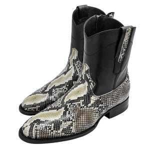 May include: Black leather cowboy boots with a snakeskin pattern. The boots have a pointed toe and a low heel.