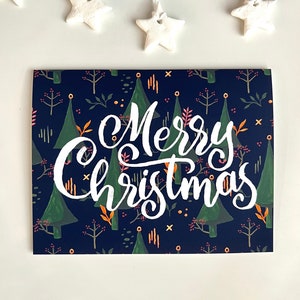 Carte magique de forêt de Joyeux Noël | pour les Fêtes de régions boisées lunatiques de Zazzle.be Liste d'envies Vous avez des idées ? Art populaire | Blanc à l'intérieur