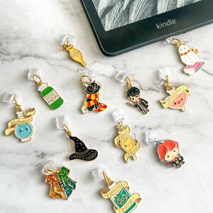 May include: A set of 11 Harry Potter themed book markers. The markers are made of metal and feature various characters and objects from the Harry Potter universe. The markers are attached to clear plastic clips.