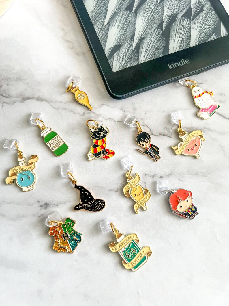 May include: A set of 11 Harry Potter themed book markers. The markers are made of metal and feature various characters and objects from the Harry Potter universe. The markers are attached to clear plastic clips.