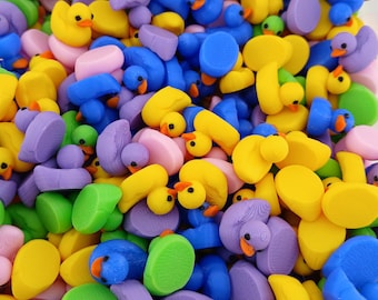 May include: A large collection of colorful rubber duckies in various shades of yellow, blue, green, purple, and pink. The duckies are arranged in a random pattern, creating a vibrant and playful display.
