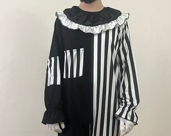 May include: A black and white striped clown costume with a white ruffle collar and a scary clown mask.
