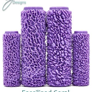 May include: Four purple textured paint rollers of different sizes. The rollers have a deep, fossilized coral texture. The text "Fossilised Coral Ultra Deep Texture" is printed below the rollers.