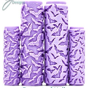May include: Four cylindrical purple rollers featuring a repeating embossed bat pattern. The text G Designs appears in the top left corner, and the text Bat out of Hell Intricate Texture is printed at the bottom of the image.