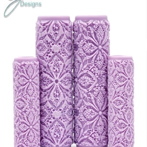 May include: Four purple textured paint rollers with an intricate design. The design is called "Cathedral Intricate Texture".