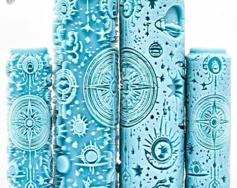 May include: A collection of light blue cylindrical tools with celestial designs, including compasses, suns, and stars. The tools are labeled "Celestial Deep Impression" and feature intricate, raised patterns. The "G Designs" logo is in the upper left corner.