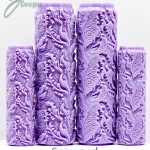 May include: Four purple textured rollers with a seaweed design. The rollers are different sizes and are arranged in a row from largest to smallest. The text "Seaweed Intricate Texture" is below the rollers.