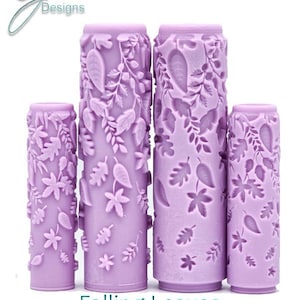 May include: Four lavender-colored rolling pins with a falling leaves design. The rolling pins vary in size and feature an intricate texture of leaves and floral patterns. The text "Falling Leaves Intricate Texture" is below the rolling pins.