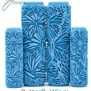 May include: Four blue paint rollers with a butterfly wing design. The rollers are different sizes and have a deep texture. The text "Butterfly Wings Deep Texture" is below the rollers.