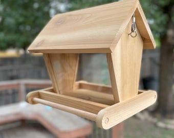 Hand crafted, hanging bird feeder, made of cedar, to keep your feathered friends well fed