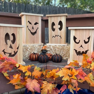 Tall, rustic, cedar Jack O' Lanterns to add to your Halloween porch decor (not for use with real candles)