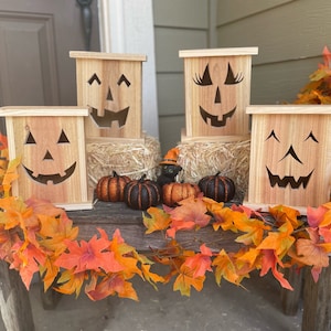 Rustic, cedar Jack O&#39; Lanterns to add to your Halloween porch decor (do not use real candles)
