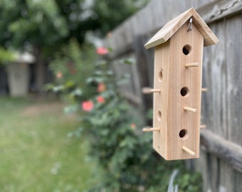 Hanging cedar bird feeder tower with multiple feeding holes to feed all your feathered friends in your backyard