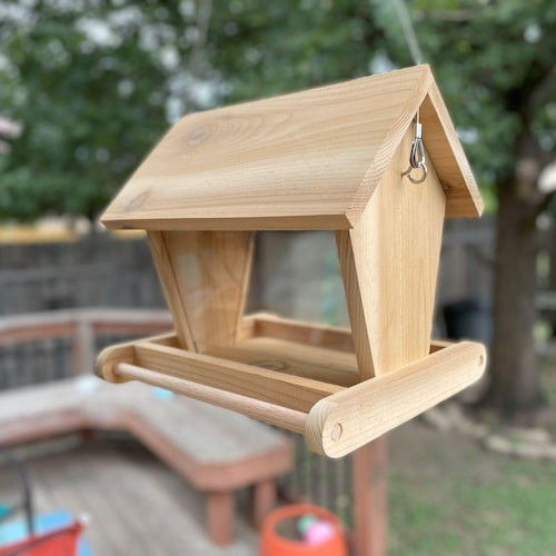 Hand crafted, hanging bird feeder, made of cedar, to keep your feathered friends well fed