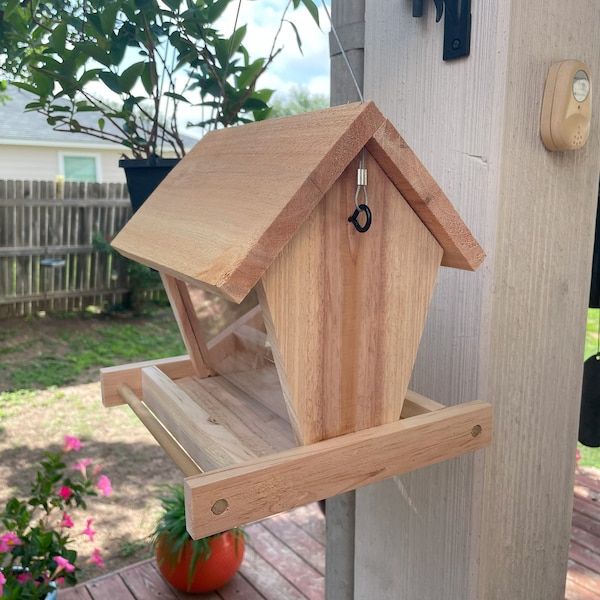 Hand crafted, hanging bird feeder, made of cedar, to keep your feathered friends well fed