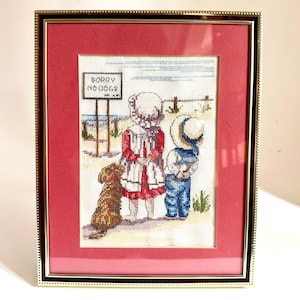 Cute Framed Cross Stitch picture of children and their dog at the beach
