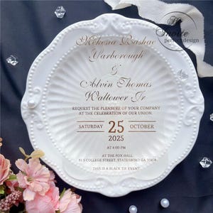 May include: A white, ornate invitation with gold text, featuring the names Mekesia Bashae Yarborough and Alvin Thomas Waltower Jr. The invitation is for a black tie event on October 25, 2025, at 4:00 PM.