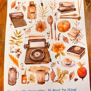 May include: A sticker sheet titled Vintage Antique Planner Stickers featuring watercolor illustrations of a typewriter, magnifying glass, pumpkin, books, mugs, leaves, and a compass. The bottom text reads JKiser.LuvinbyJessica.etsy All about the HOme!