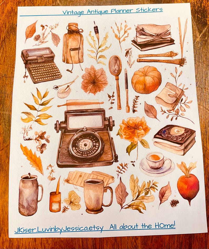 May include: A sticker sheet titled Vintage Antique Planner Stickers featuring watercolor illustrations of a typewriter, magnifying glass, pumpkin, books, mugs, leaves, and a compass. The bottom text reads JKiser.LuvinbyJessica.etsy All about the HOme!