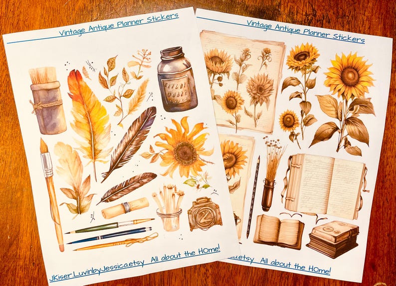 May include: Two sheets of planner stickers titled Vintage Antique Planner Stickers and JKiser LuvinbyJessicaetsy All about the HOme!. The stickers feature watercolor illustrations of sunflowers, feathers, ink bottles, paintbrushes, pencils, and open books in shades of brown, yellow, and gold.