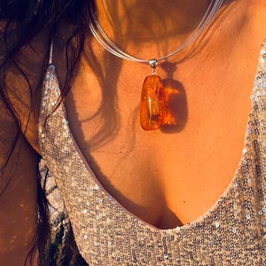 Baltic Amber Pendant: Sterling Silver, Honey Color, Fossil Inclusions