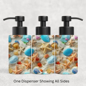 May include: Three views of a cylindrical soap dispenser featuring a repeating pattern of colorful seashells and starfish in shades of blue, orange, and cream against a sandy background, topped with a black plastic pump mechanism.