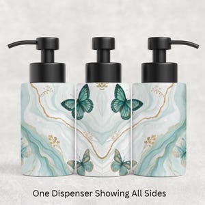 May include: Three soap dispensers with black pump heads, featuring a white and teal marbled pattern with gold-colored veining and teal butterfly illustrations. The text below reads: One Dispenser Showing All Sides.