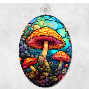 May include: Oval-shaped wall art featuring a vibrant illustration of colorful mushrooms. The artwork showcases orange and red mushroom caps with purple and green foliage against a blue and teal background. A suction cup is attached at the top.