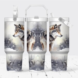 A set of three identical stainless steel tumblers with a watermark design featuring a wolf's head against a snowy landscape.