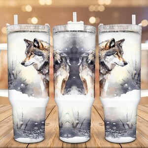 A set of three large, clear tumblers with a design featuring a wolf's face on each one.