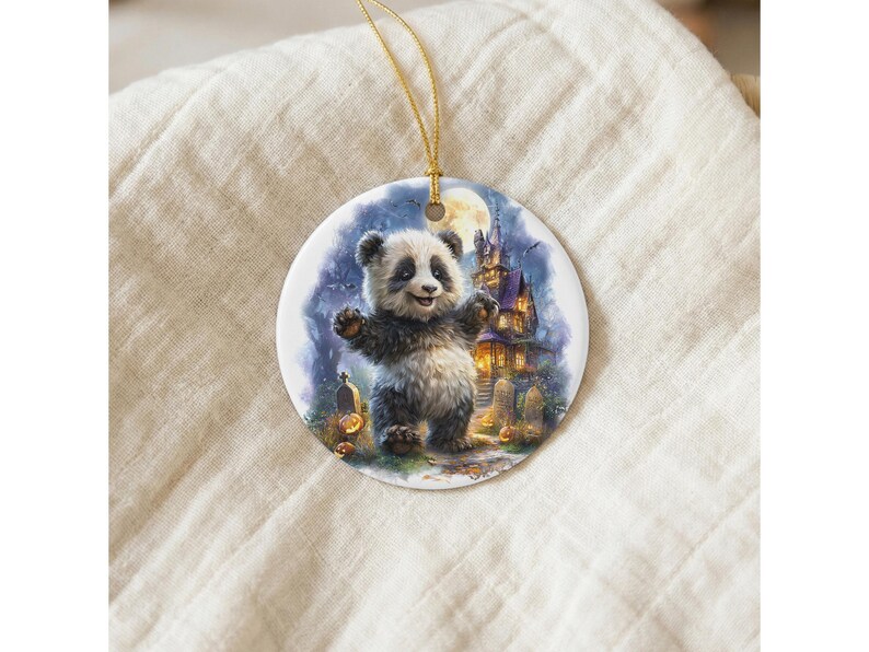 A panda bear standing on a grassy field with a castle in the background, as depicted on a circular ornament.